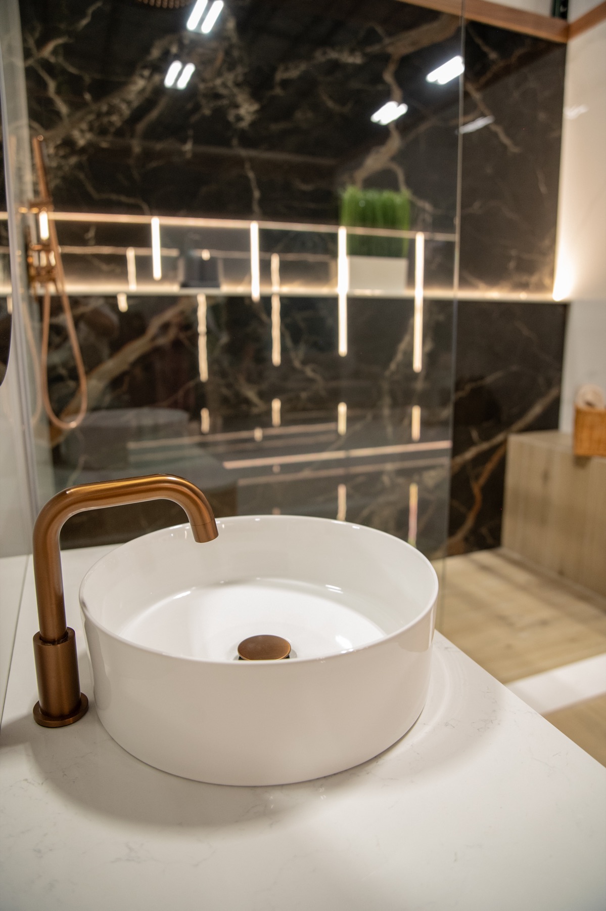Bathroom sink and bronze fixture detail